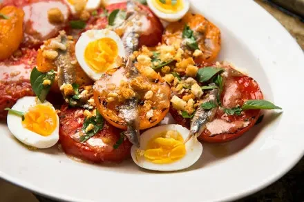 Charred Tomatoes with Egg, Anchovies, and Crispy Breadcrumbs