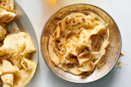 Buss Up Shut Roti: A Caribbean Twist on Unleavened Flaky Layers